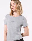 Model wearing a gray t-shirt with 'LEGEND'printed in black in the center of the chest on a white background
