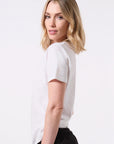 Model wearing a white t-shirt and black sweat pants on a white background