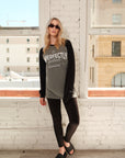 Model wearing a 'IMPERFECTLY Perfect' shirt on a rooftop with cityscape background